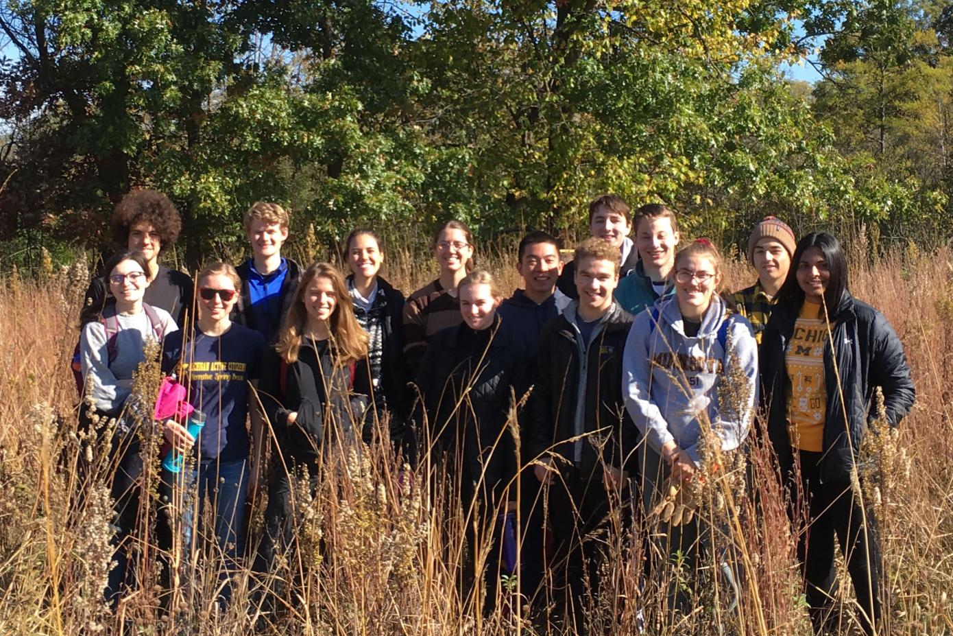 A group of volunteers together in a field